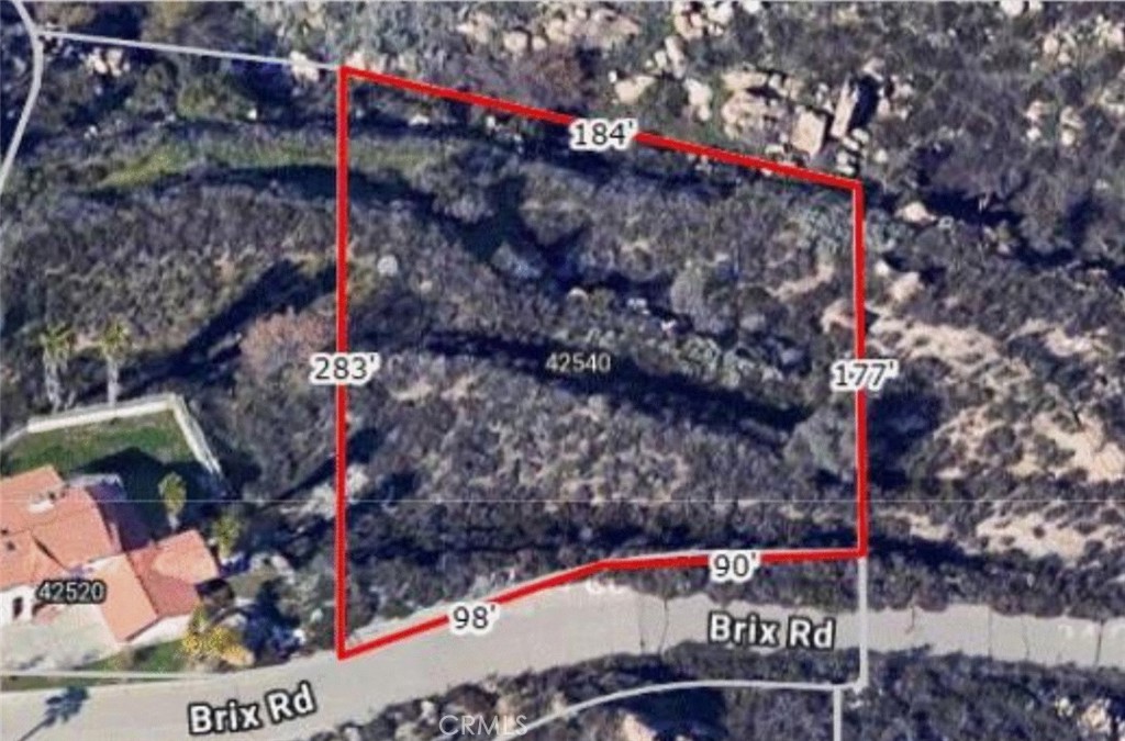 42540 Brix Road Hemet, CA 92544 - Photo 21 of 29 a street sign on a street next to a building