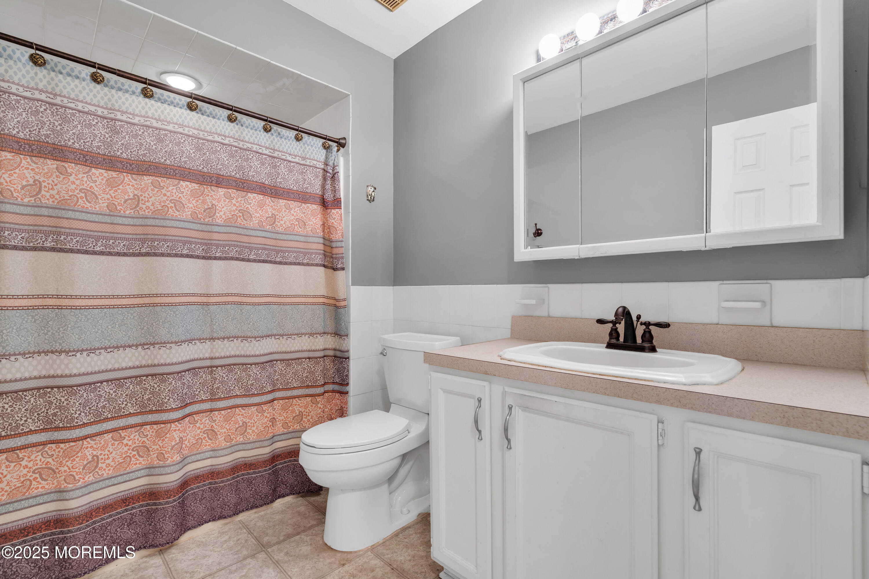 638 Freehold Road Jackson, NJ 08527 - Photo 15 of 61 a bathroom with a sink toilet and vanity