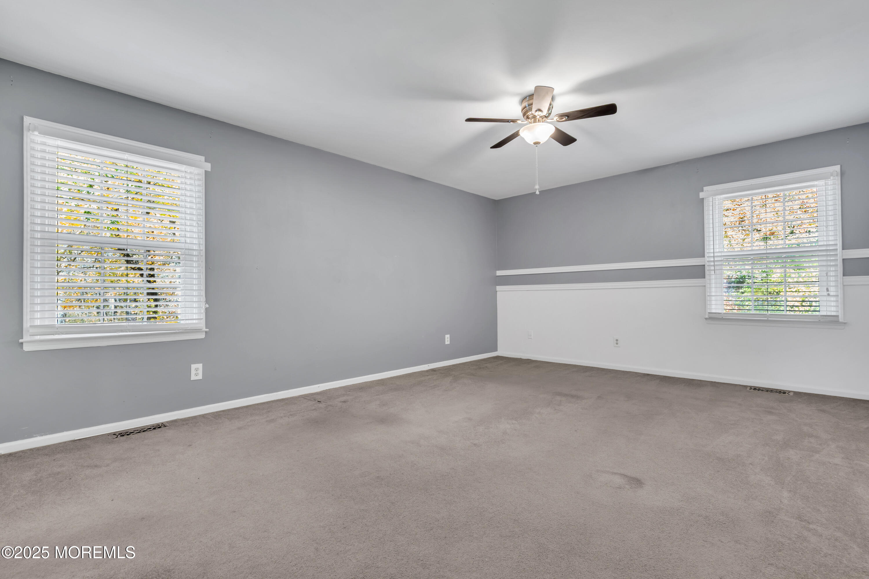 638 Freehold Road Jackson, NJ 08527 - Photo 18 of 61 an empty room with windows and ceiling fan