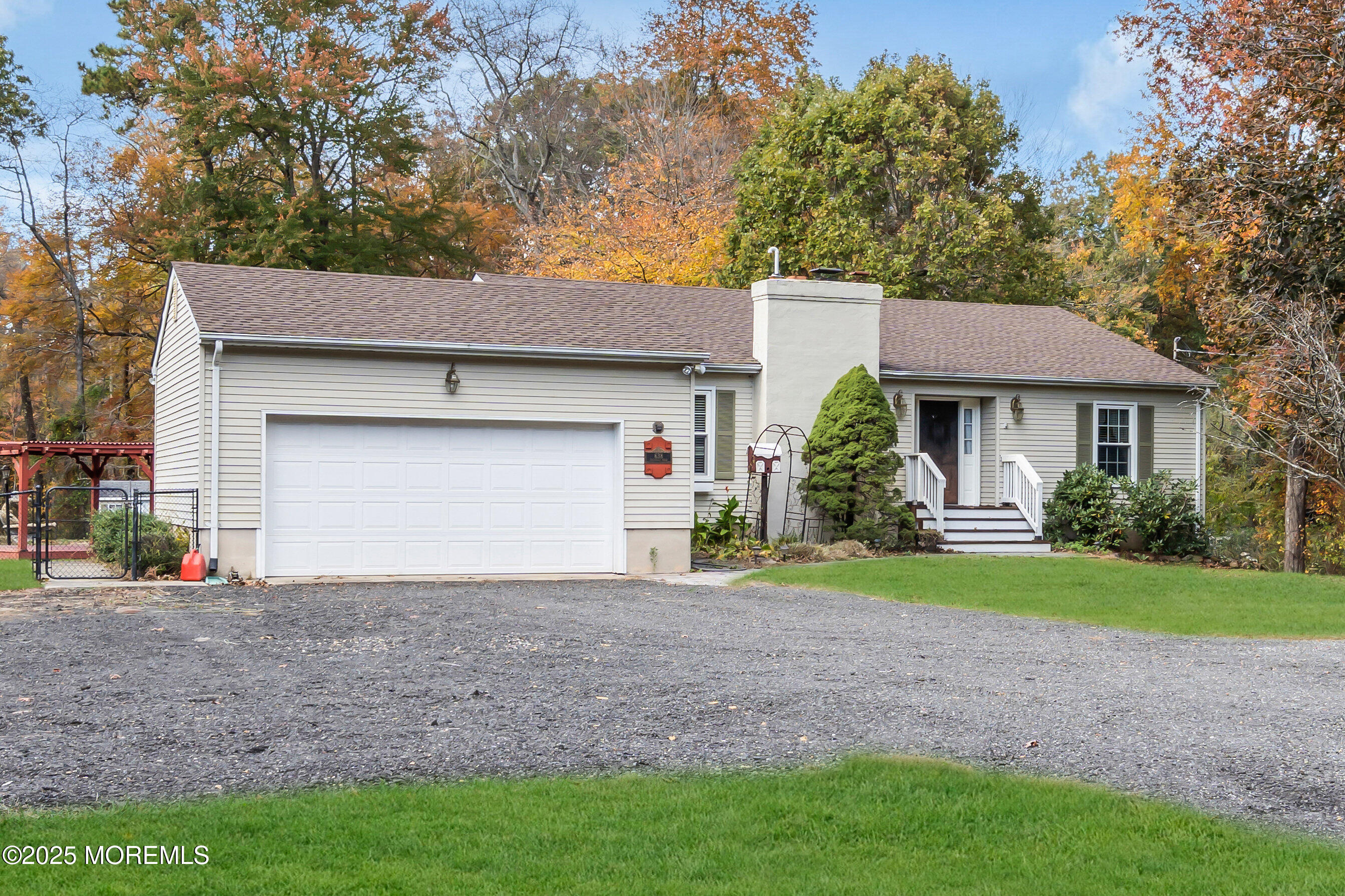 638 Freehold Road Jackson, NJ 08527 - Photo 2 of 61 a front view of a house with a yard and garage