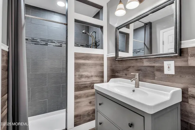 a white toilet sitting next to a bathroom sink