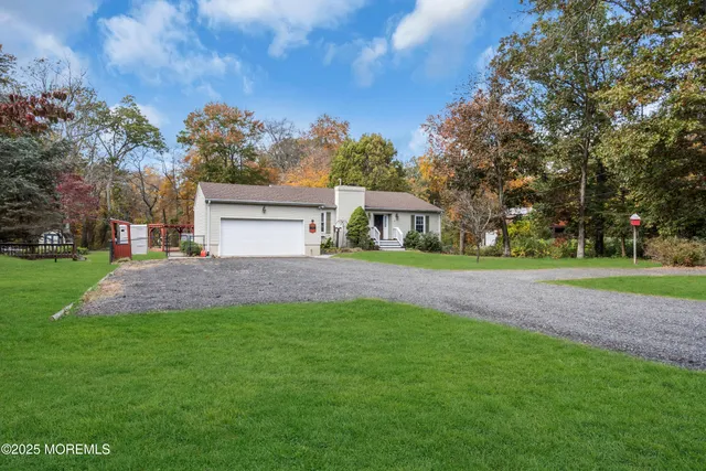 a kitchen with stainless steel appliances granite countertop a sink refrigerator and cabinets