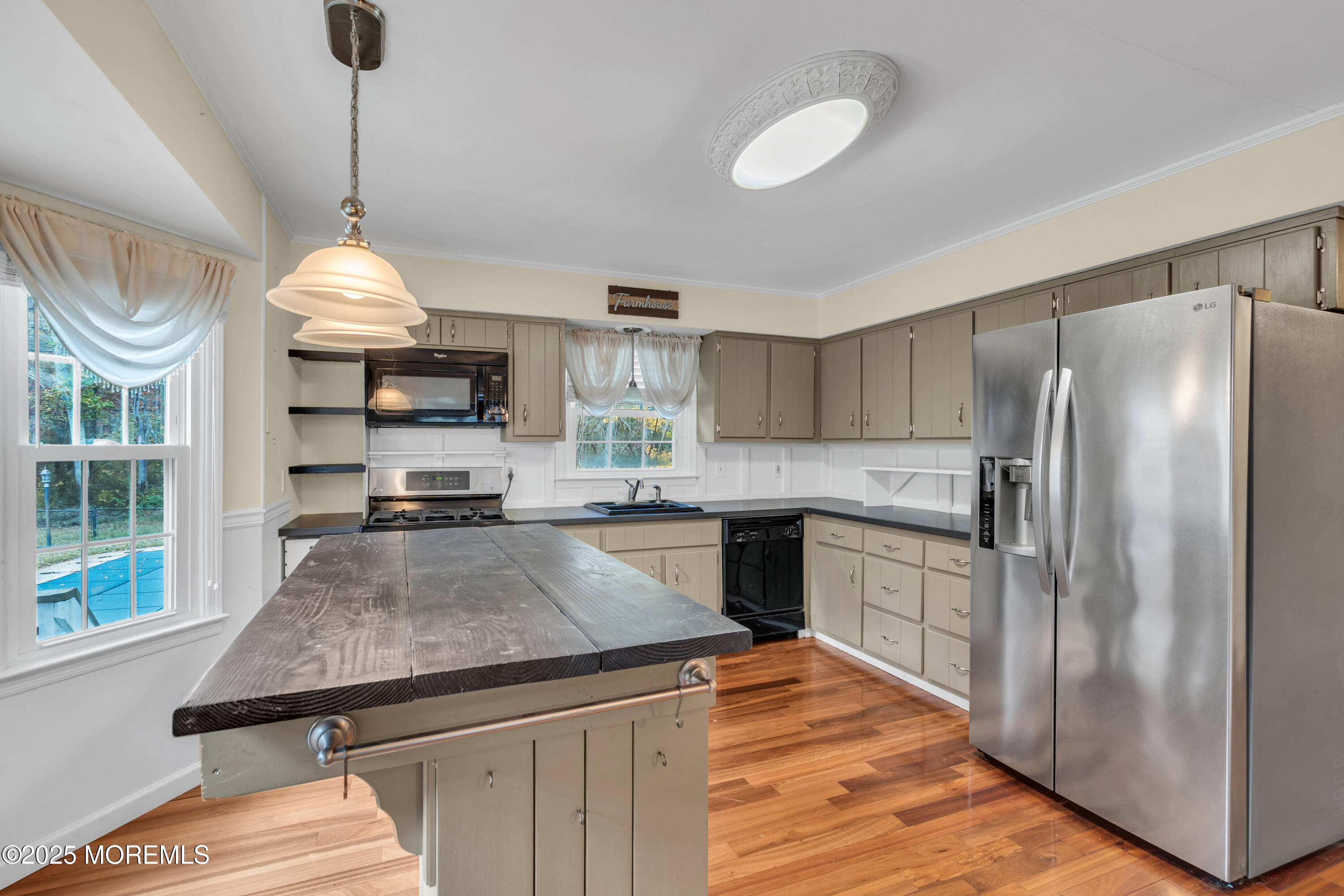 638 Freehold Road Jackson, NJ 08527 - Photo 45 of 61 a kitchen with stainless steel appliances granite countertop a sink refrigerator and cabinets