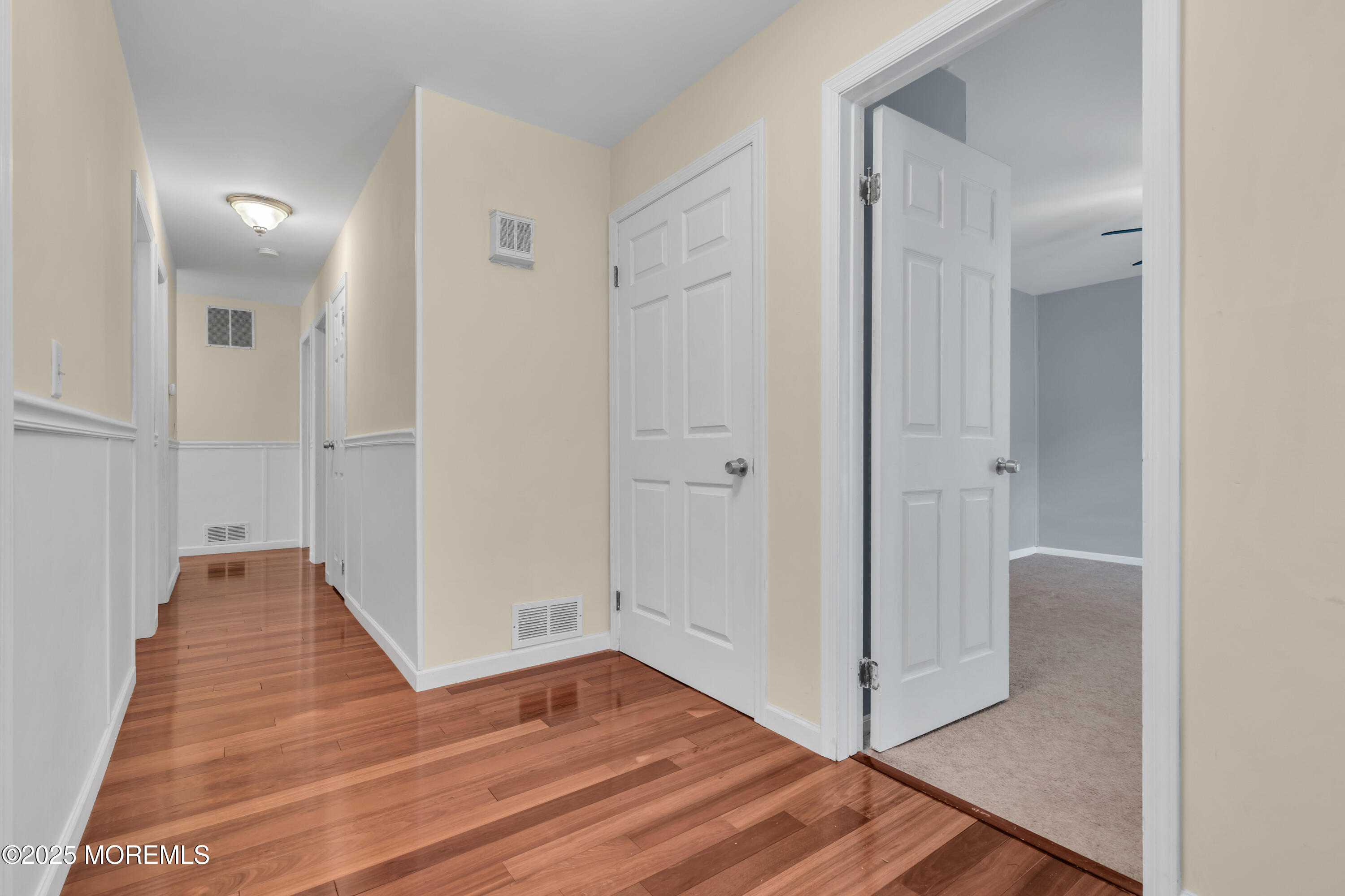 638 Freehold Road Jackson, NJ 08527 - Photo 6 of 61 a view of a hallway with wooden floor