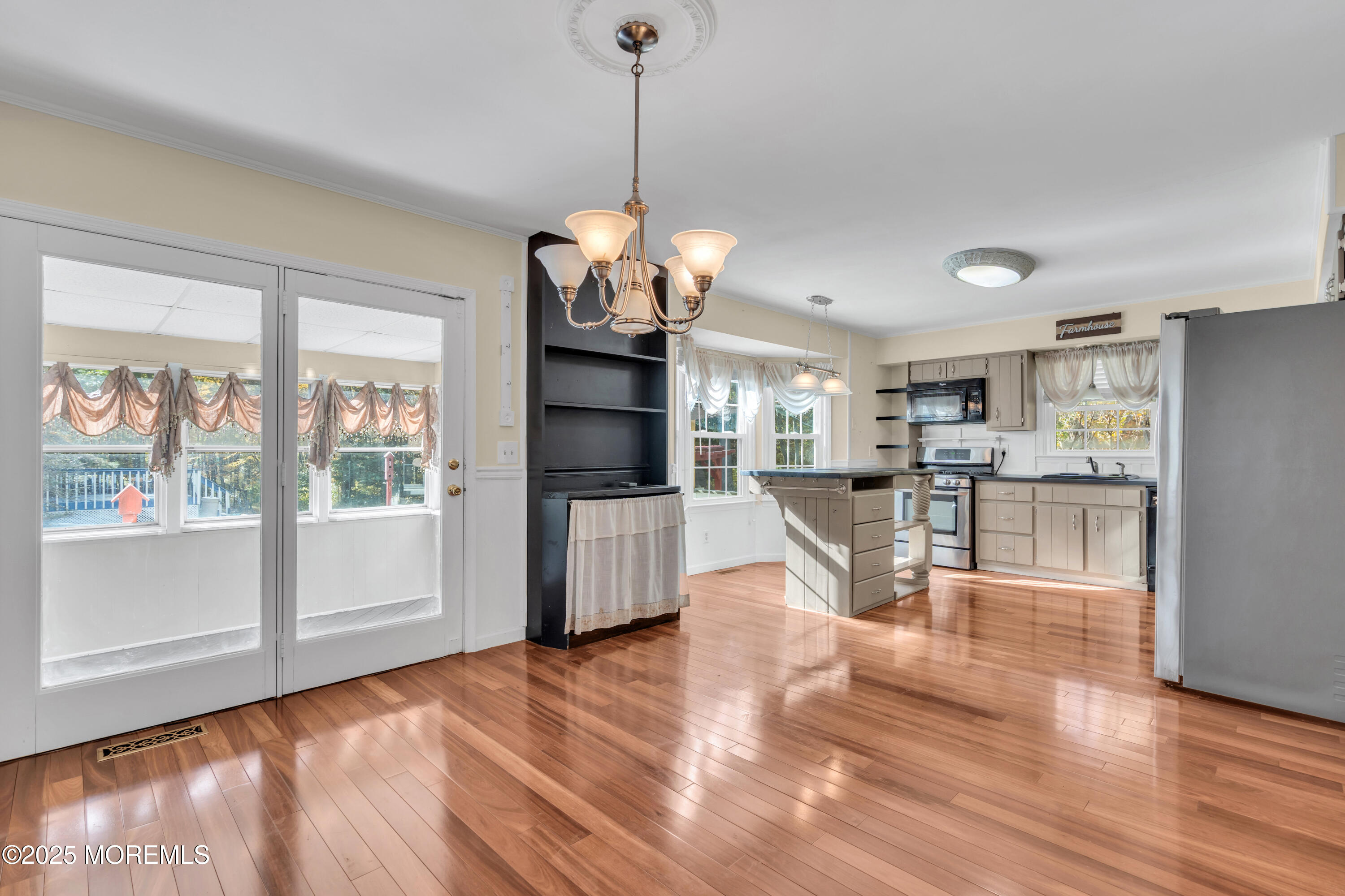 638 Freehold Road Jackson, NJ 08527 - Photo 10 of 61 a view of a kitchen with microwave and wooden floor