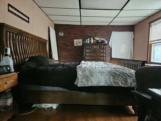 a bedroom with a bed and a walk in closet