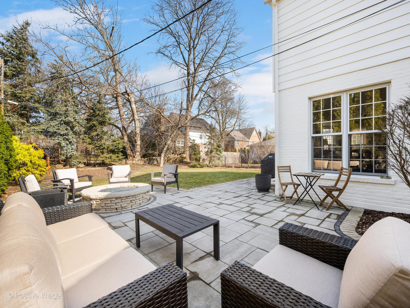 207 Ravine Road Hinsdale, IL 60521 - Photo 29 of 35 a view of a patio with couches and a table and chairs with wooden fence