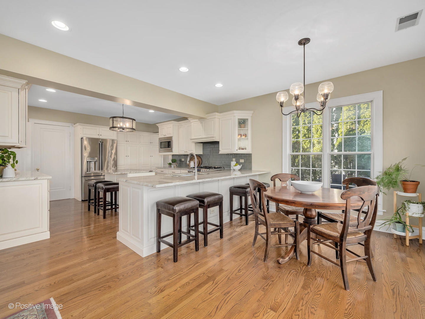 207 Ravine Road Hinsdale, IL 60521 - Photo 8 of 35 a view of a dining room with furniture window and wooden floor