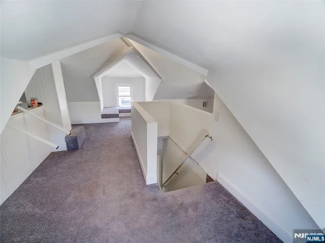 a view of a hallway view with staircase