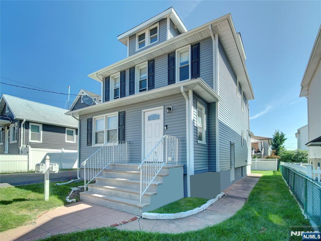 222 Lafayette Avenue, Unit 2 Lyndhurst, NJ 07071 - Photo 2 of 15 a front view of a house with a yard