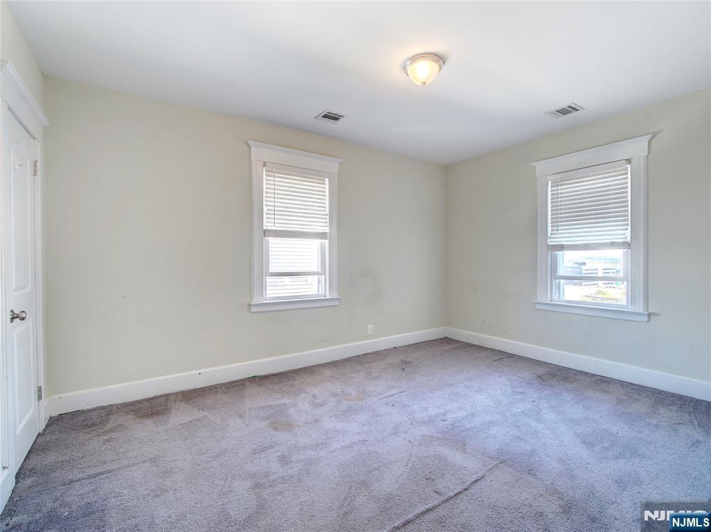 222 Lafayette Avenue, Unit 2 Lyndhurst, NJ 07071 - Photo 7 of 15 an empty room with a window