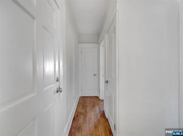 a view of a hallway with a white walls