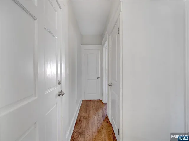 a view of a hallway with a white walls