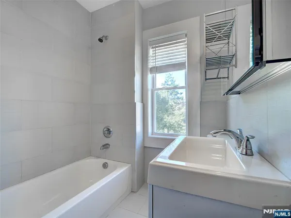 a bathroom with a sink and a bathtub