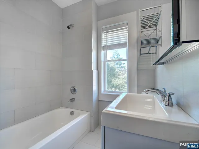 a bathroom with a sink and a bathtub