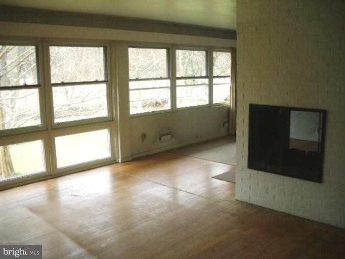 7904 Springway Road Towson, MD 21204 - Photo 7 of 13 a view of an empty room with a window