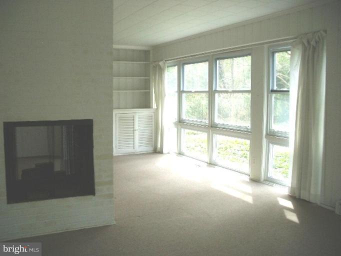 7904 Springway Road Towson, MD 21204 - Photo 9 of 13 a view of empty room with floor to ceiling window