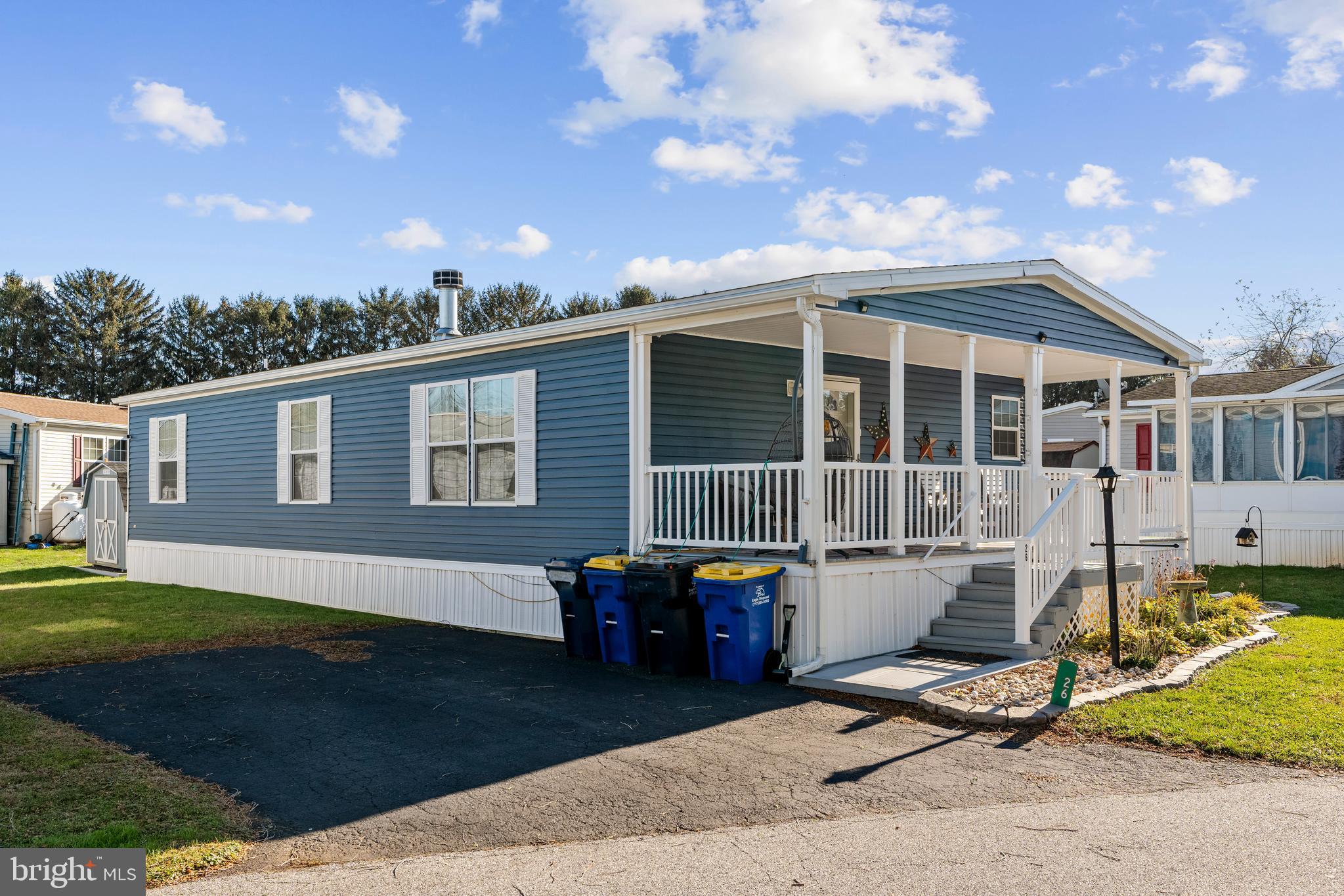 a view of a house with backyard sitting area and garden