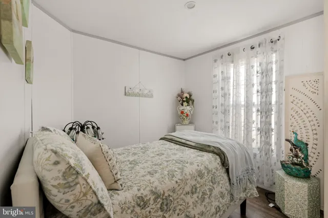 a bedroom with a bed and a chair