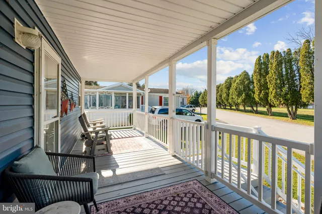 a view of a balcony with furniture