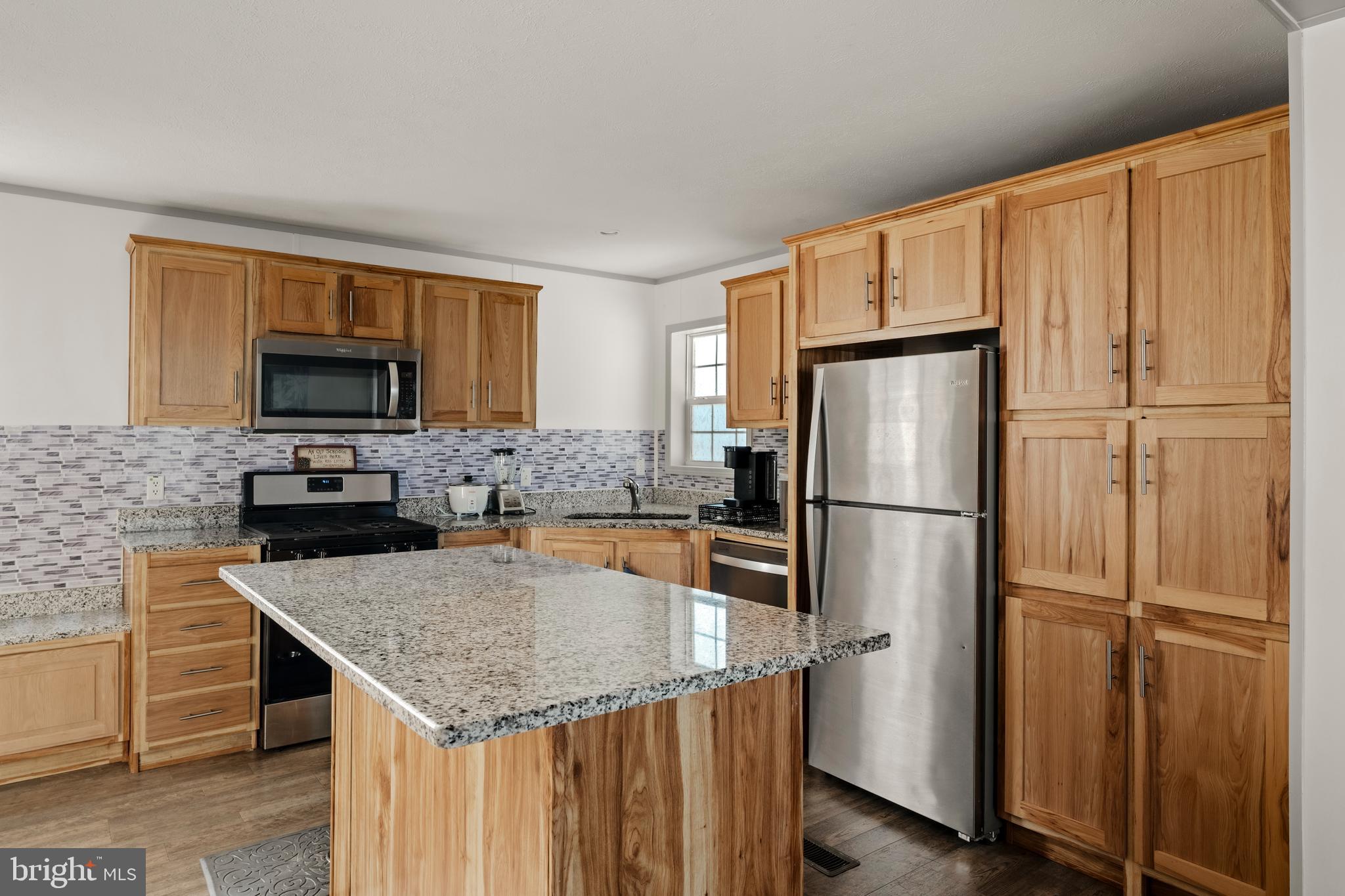 26 Ruth Drive Gordonville, PA 17529 - Photo 6 of 29 a kitchen with stainless steel appliances granite countertop a refrigerator a stove a sink and a microwave