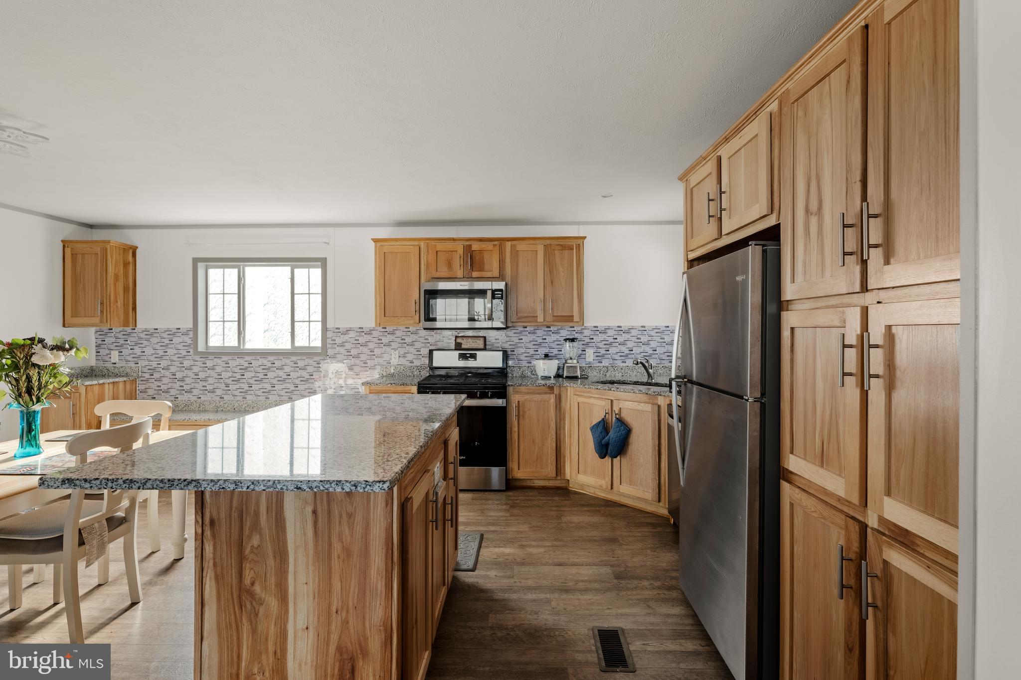 26 Ruth Drive Gordonville, PA 17529 - Photo 7 of 29 a kitchen with white cabinets and stainless steel appliances