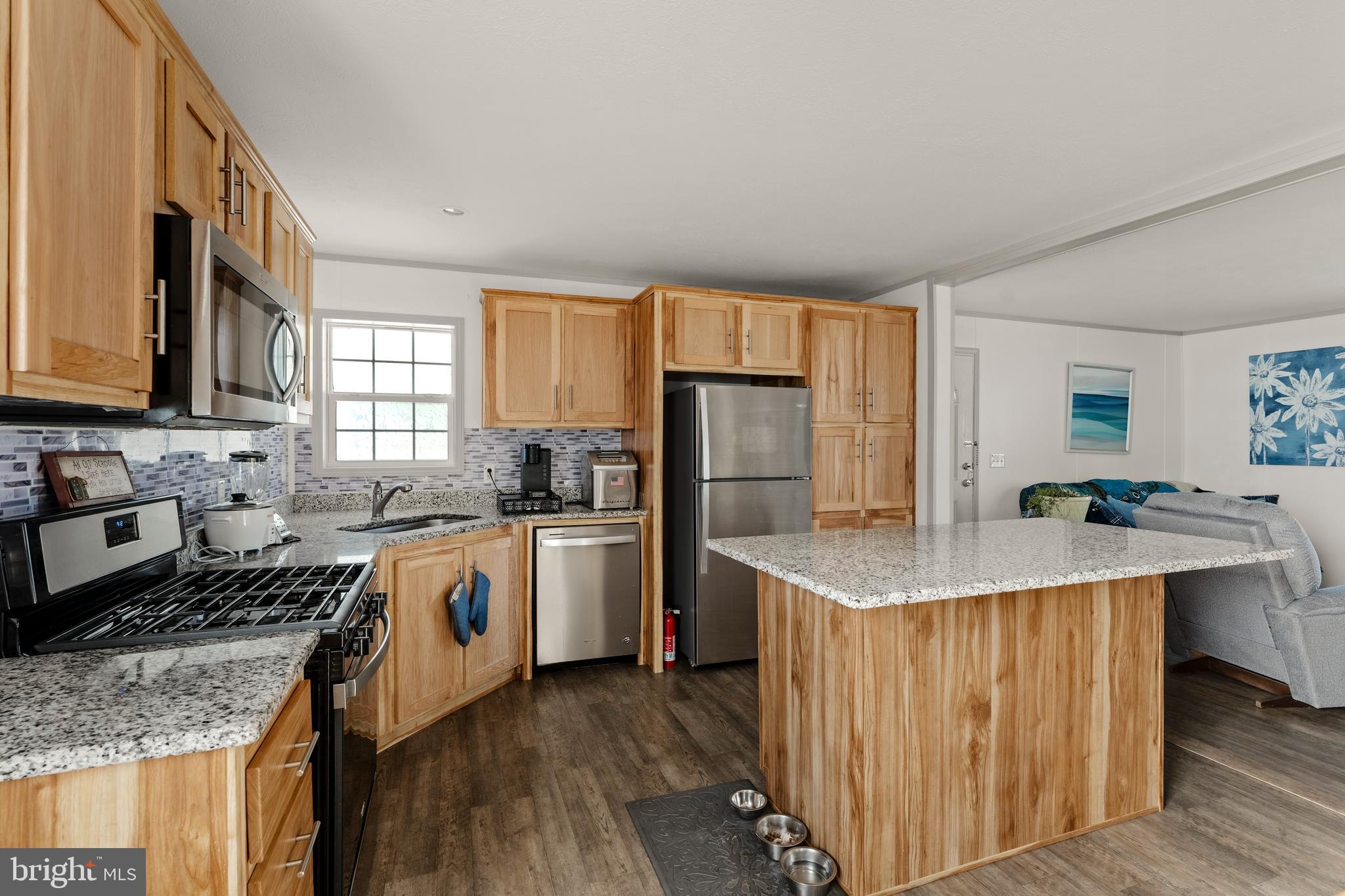 26 Ruth Drive Gordonville, PA 17529 - Photo 9 of 29 a kitchen with stainless steel appliances granite countertop a sink stove refrigerator and cabinets