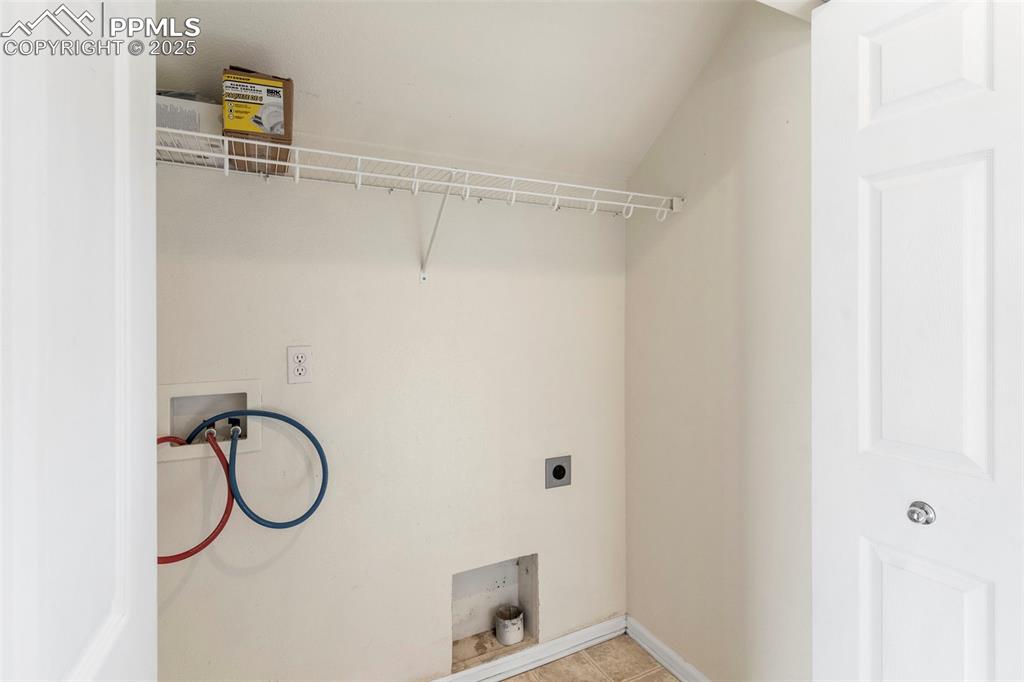 7710 Sistine Lane Fountain, CO 80817 - Photo 16 of 33 a bathroom with a shower and a mirror