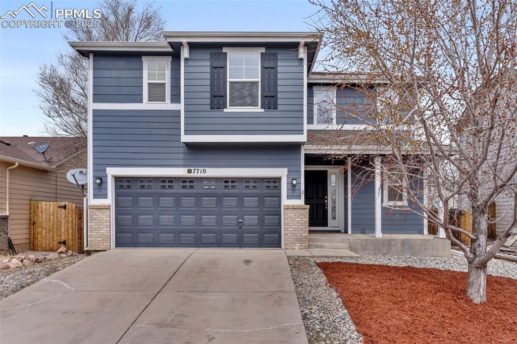 7710 Sistine Lane Fountain, CO 80817 - Photo 2 of 33 a front view of a house with a yard and garage