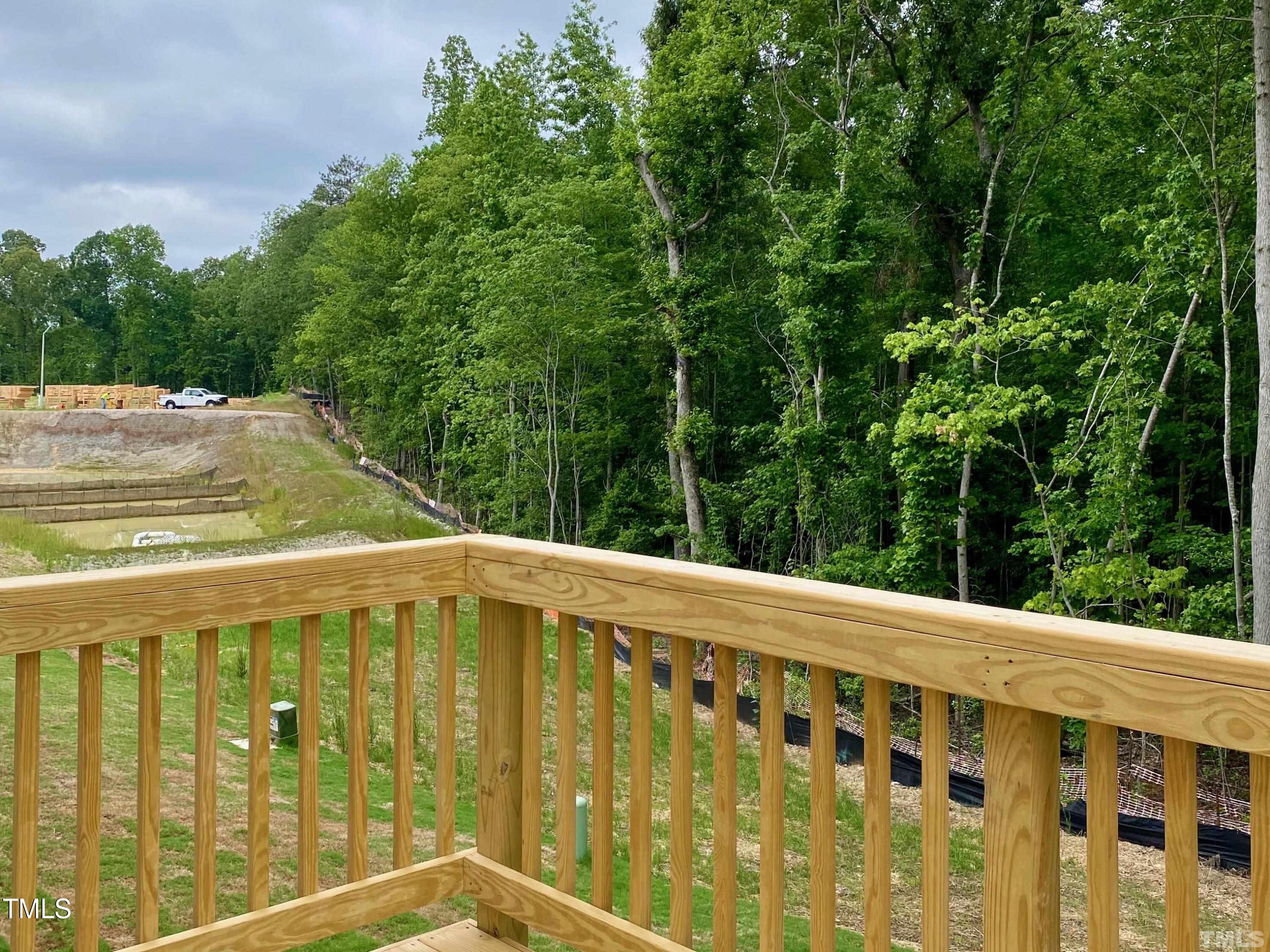 6627 Pathfinder Way Raleigh, NC 27616 - Photo 32 of 35 a view of swimming pool with trees in the background