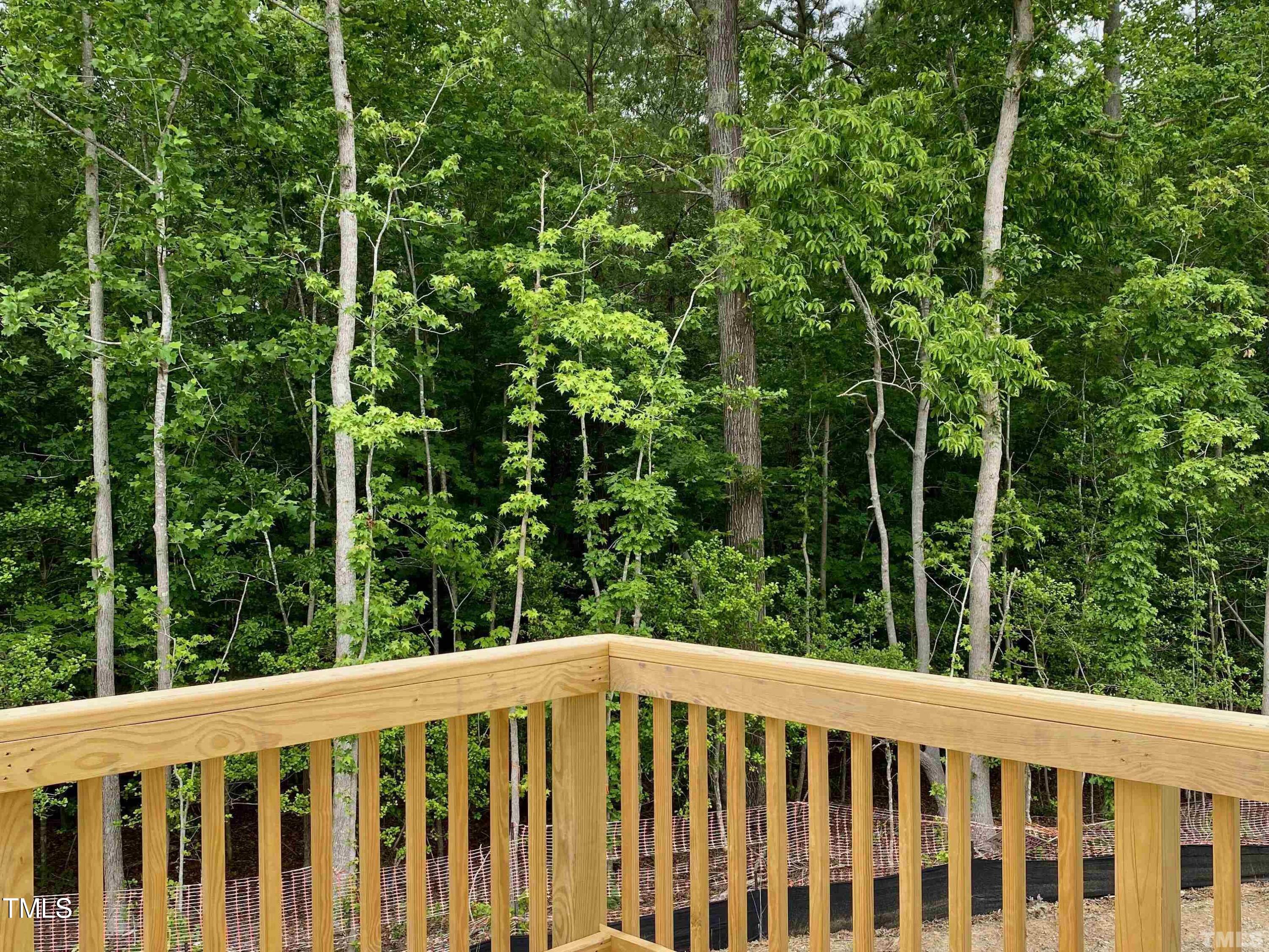 6627 Pathfinder Way Raleigh, NC 27616 - Photo 33 of 35 a view of a wooden fence and trees