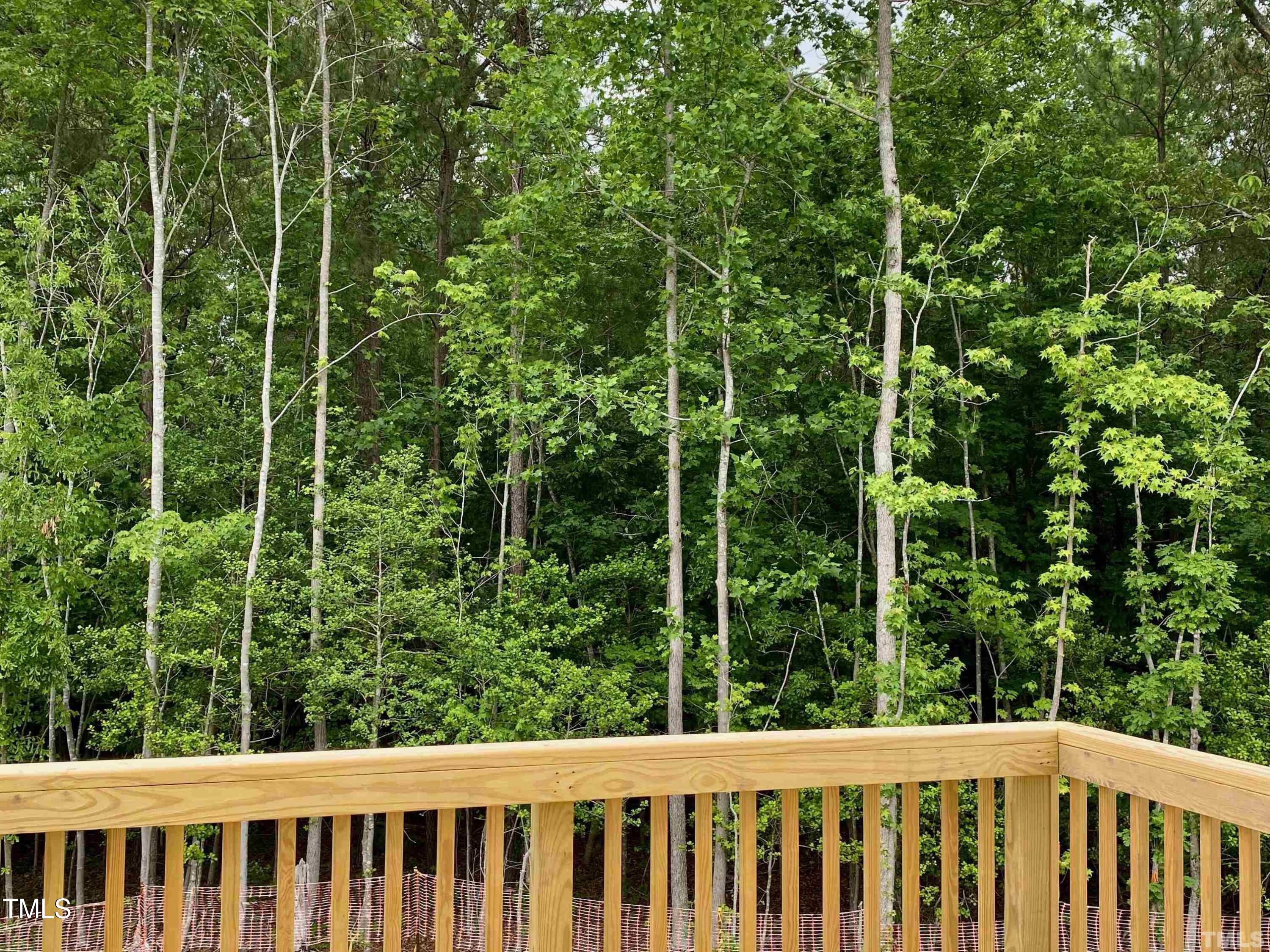6627 Pathfinder Way Raleigh, NC 27616 - Photo 34 of 35 a view of a yard with a wooden fence