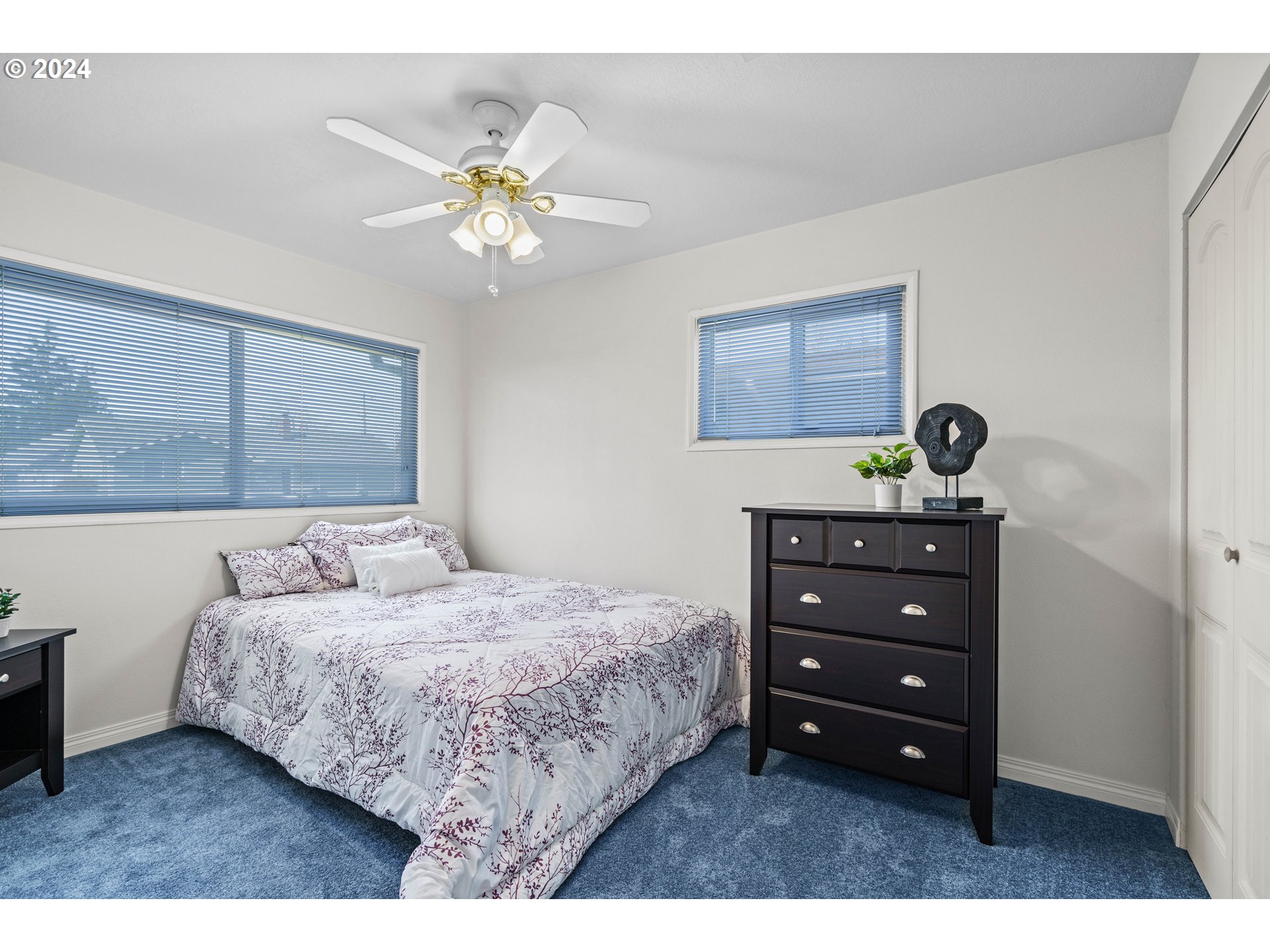 1841 Market Street Springfield, OR 97477 - Photo 15 of 23 a bedroom with a bed and a chandelier