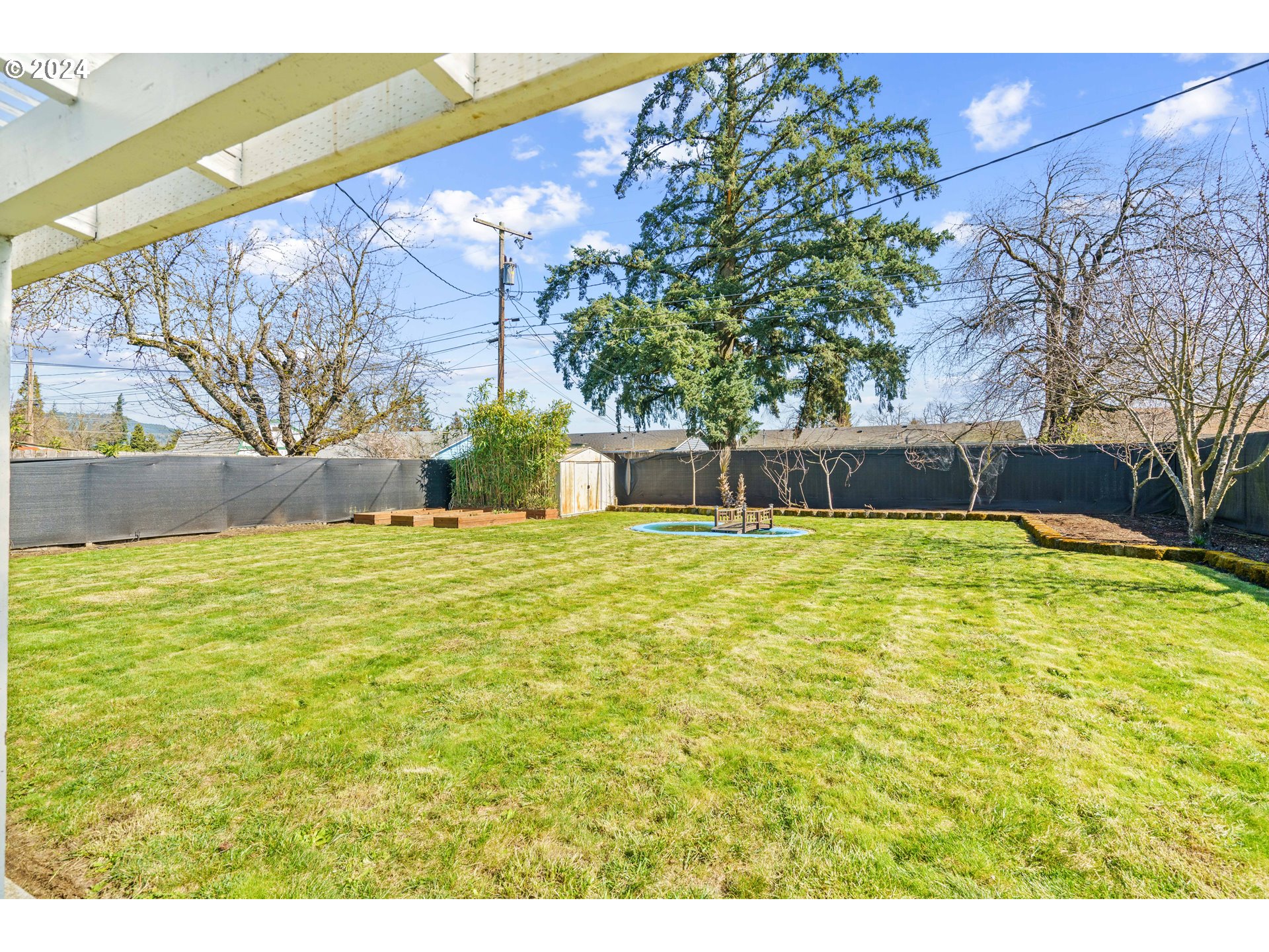 1841 Market Street Springfield, OR 97477 - Photo 21 of 23 a swimming pool with trees in the background