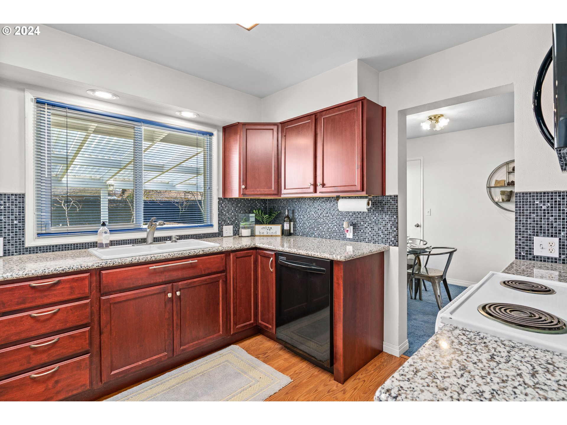 1841 Market Street Springfield, OR 97477 - Photo 8 of 23 a kitchen with stainless steel appliances granite countertop a sink stove and cabinets