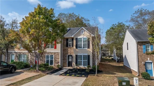a front view of a house with garden