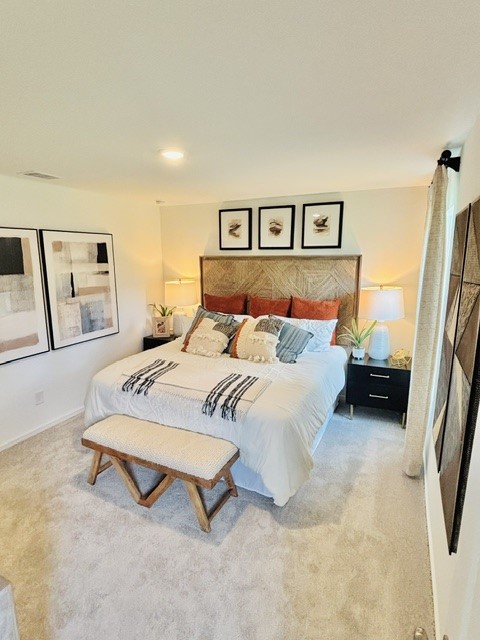 2126 Mosaic Vly Court Angleton, TX 77515 - Photo 19 of 40 a bedroom with a bed and a painting on the wall