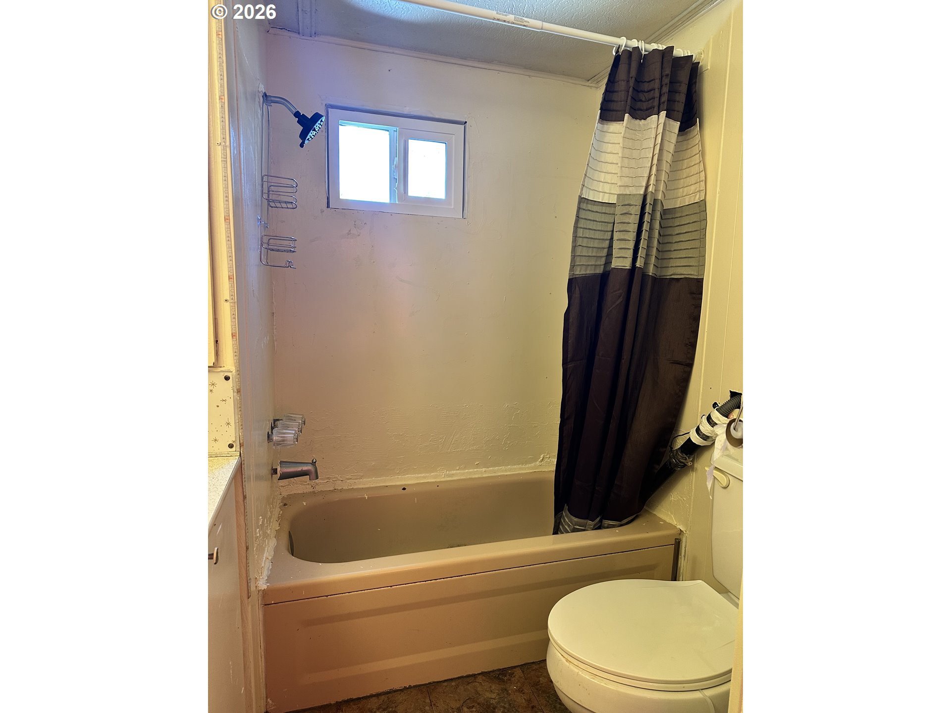 37635 Row River Road, Unit 7 Dorena, OR 97434 - Photo 20 of 27 a bathroom with a toilet a sink and bathtub