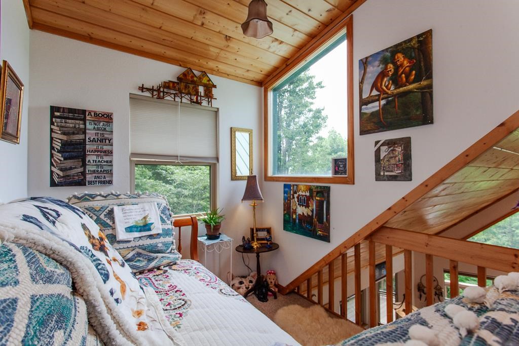 164 Freedom Pass Drive Murphy, NC 28906 - Photo 15 of 65 a view of a livingroom with furniture staircase and windows