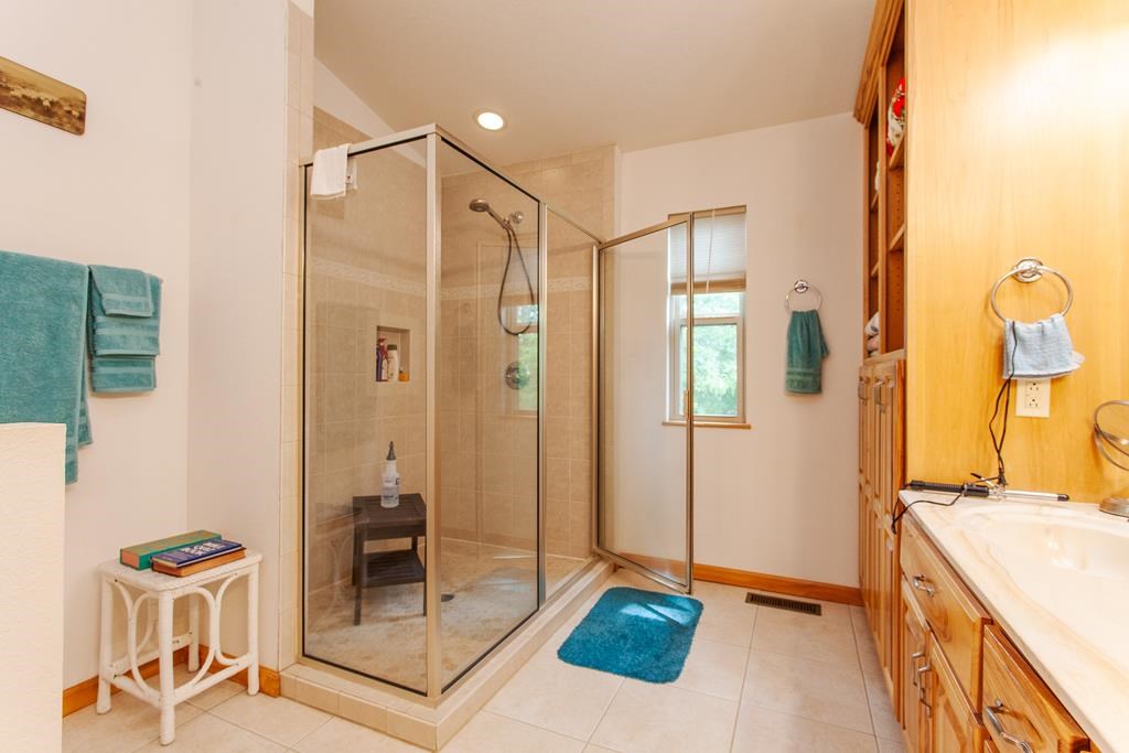 164 Freedom Pass Drive Murphy, NC 28906 - Photo 20 of 65 a bathroom with a shower and a sink