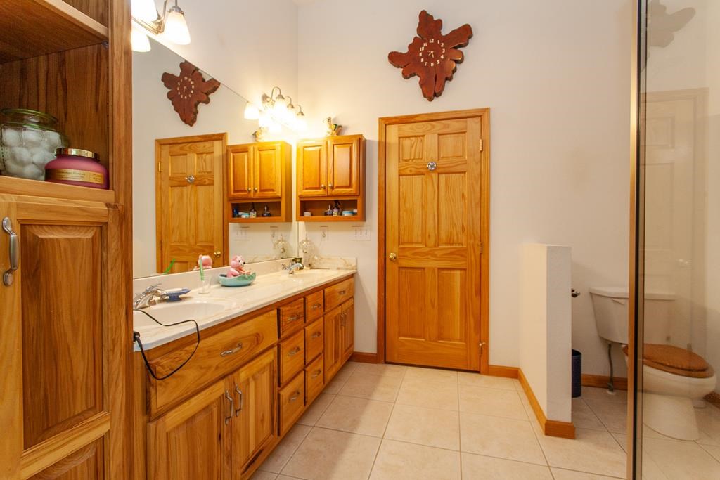 164 Freedom Pass Drive Murphy, NC 28906 - Photo 22 of 65 a bathroom with a double vanity sink a mirror and a shower