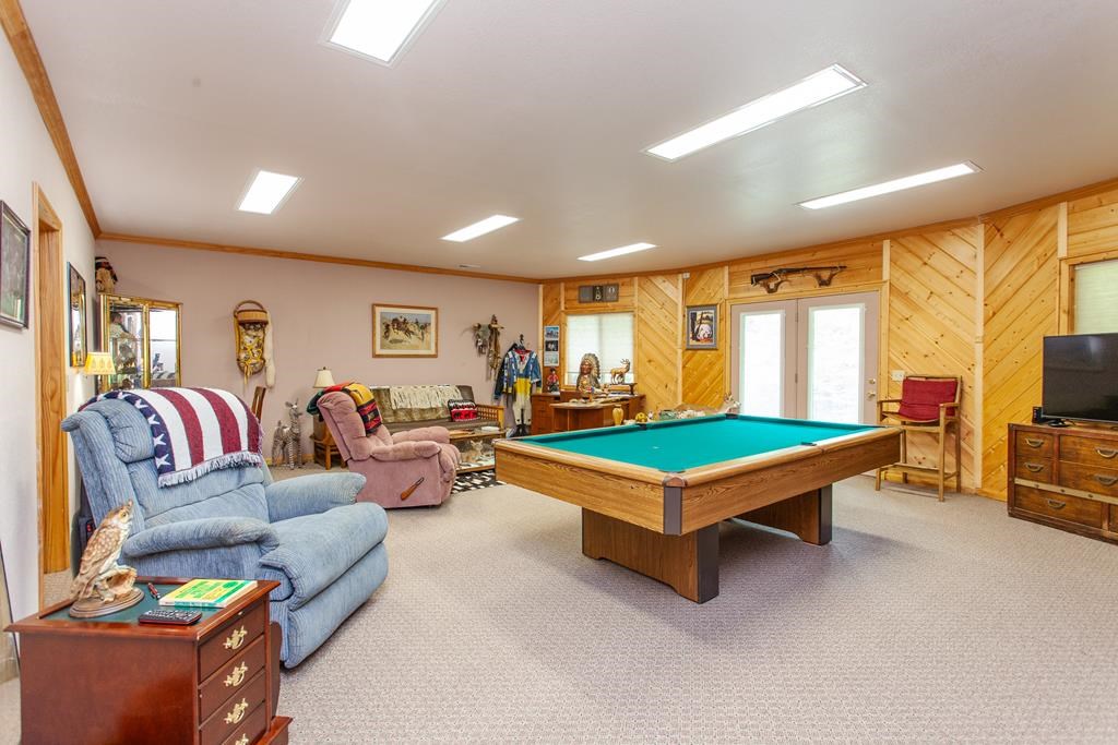 164 Freedom Pass Drive Murphy, NC 28906 - Photo 25 of 65 a living room with furniture a flat screen tv and a pool table