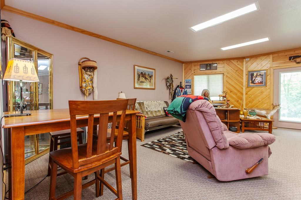 164 Freedom Pass Drive Murphy, NC 28906 - Photo 28 of 65 a living room with furniture a dining table and a flat screen tv