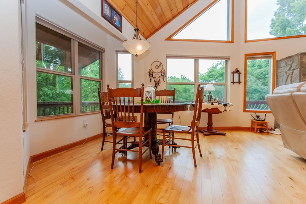 164 Freedom Pass Drive Murphy, NC 28906 - Photo 58 of 65 a dining room with furniture window and wooden floor