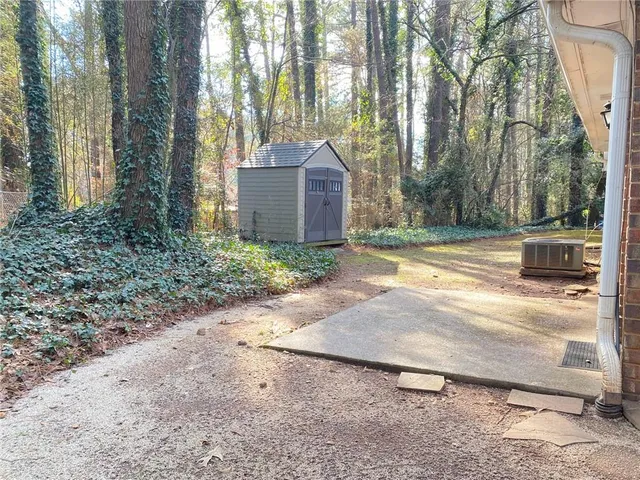 a view of a house with a small yard