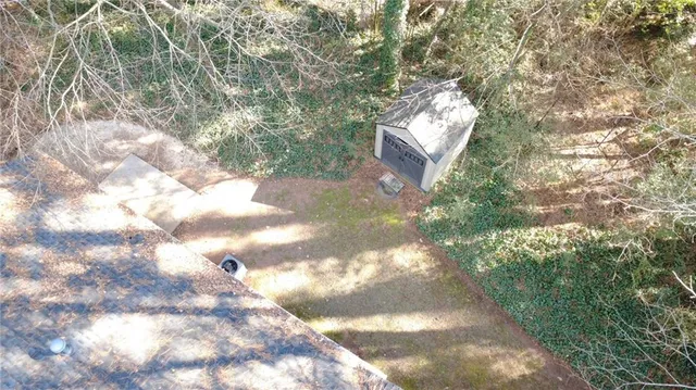 a view of a house with brick walls