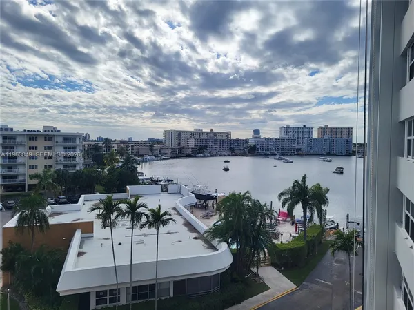 a view of a swimming pool and outside seating