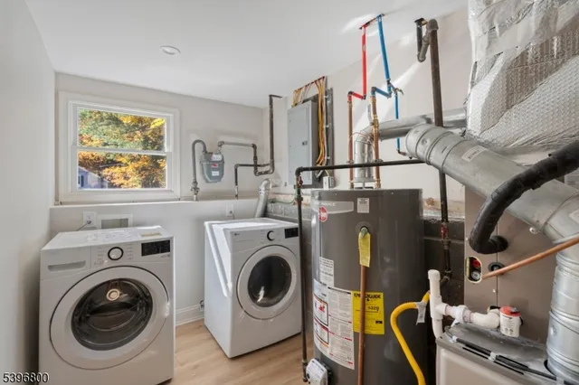 a view of storage and utility room with washer and dryer