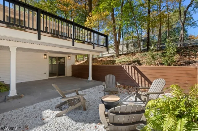 a view of a patio with table and chairs and potted plants