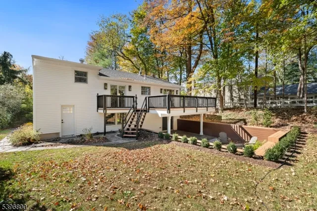 a view of a house with wooden fence